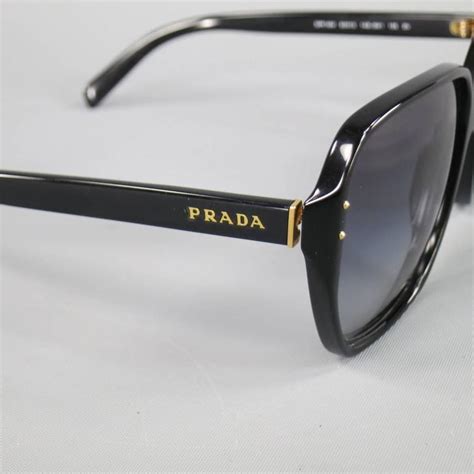 prada sunglasses black and gold|prada unisex sunglasses.